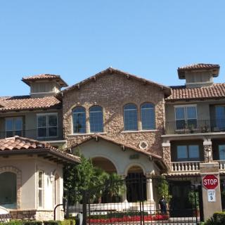 A beautifully designed residential building with brick and tile accents.
