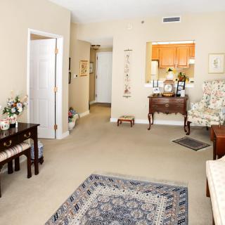 A cozy living room with elegant furniture and decor.