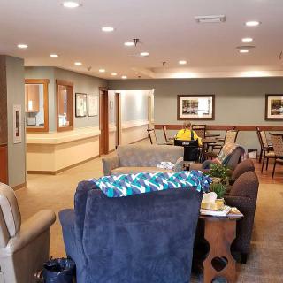 A cozy indoor lounge area with comfortable seating and warm lighting.