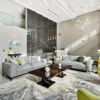 A modern living room featuring sleek furniture and contemporary decor.