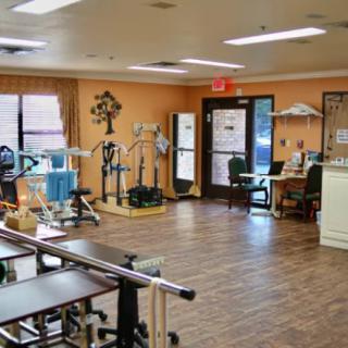 A rehabilitation center equipped with exercise machines and therapy equipment.