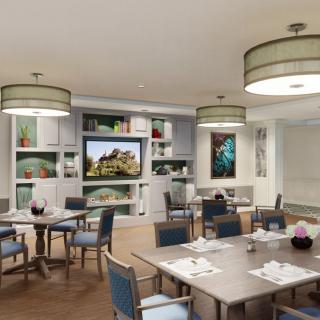 A modern dining area featuring stylish furniture and elegant lighting.