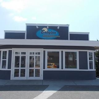 A restaurant exterior with a prominent sign above the entrance.