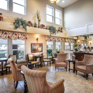 A spacious and well-lit lobby with comfortable seating and tasteful decor.