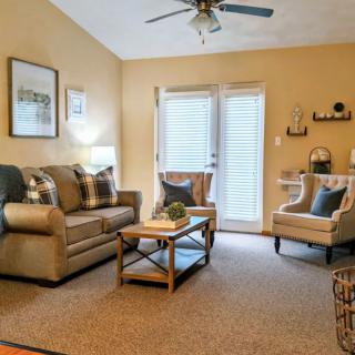 Cozy living room with comfortable seating and warm decor.
