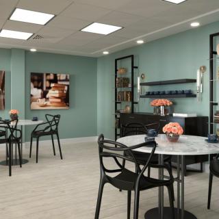 A modern cafe interior with stylish decor and seating arrangements.