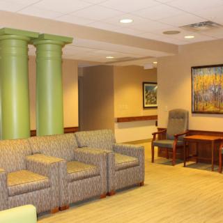A welcoming waiting room with comfortable seating and colorful artwork.