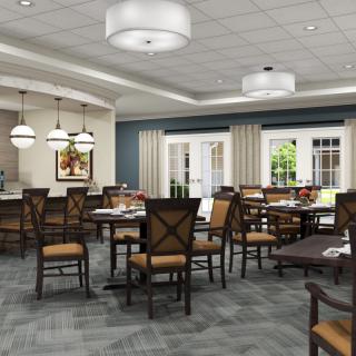 A spacious and elegantly designed dining room with multiple tables and chairs, featuring modern lighting and decor.