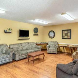 A cozy and inviting living room setup featuring comfortable sofas and a TV, ideal for relaxation.