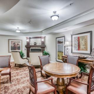 A cozy and elegant living room with classic furniture and tasteful artwork.