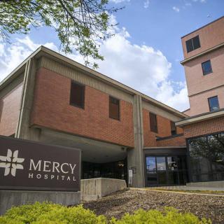 A view of Mercy Hospital's exterior, showcasing its modern architectural design.