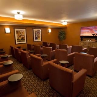 A cozy home theater room with comfortable seating and ambient lighting.
