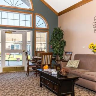 A cozy living room with elegant furnishings and abundant natural light.