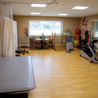 A well-equipped therapy room designed for physical rehabilitation and fitness activities.