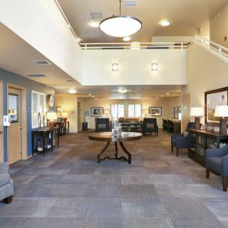 A spacious lobby area with comfortable seating and elegant lighting.