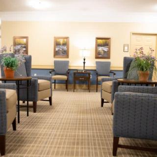 A cozy and well-arranged lobby with comfortable seating and decorative plants.