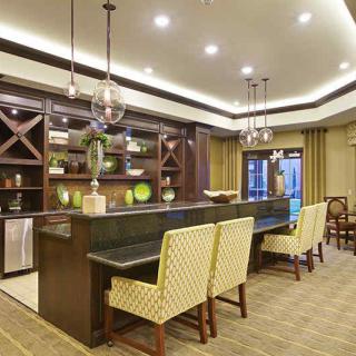 A modern kitchen bar area with elegant lighting and stylish decor.