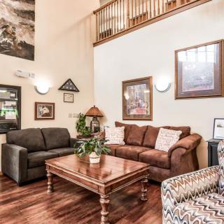 A cozy living room with comfortable seating and elegant decor.