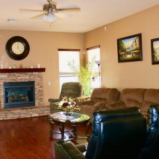 Cozy living room with a fireplace and comfortable seating.