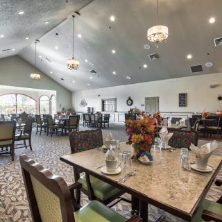 An elegant dining room with beautifully set tables and modern decor.