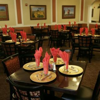 An elegantly arranged restaurant dining area with tables set for guests.
