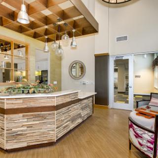 A modern reception area featuring natural wood elements and stylish decor.