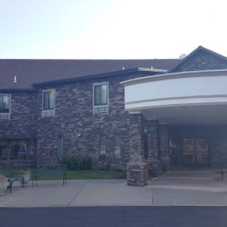 A welcoming stone building featuring a spacious entrance.