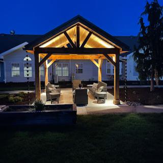 A beautifully illuminated outdoor pergola, perfect for evening gatherings.