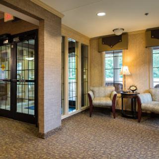 A cozy lobby area featuring comfortable seating and modern decor.