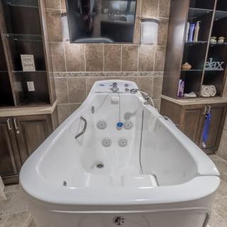 A modern bathtub designed for relaxation and comfort, set in a stylish bathroom environment.