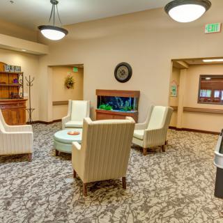 A cozy lounge area with chairs arranged around a small table.