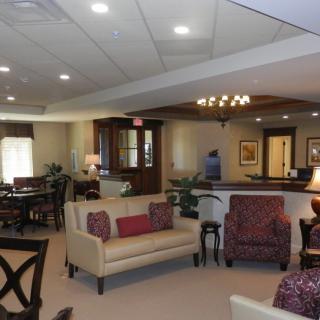 A spacious living room with elegant furniture and warm decor.