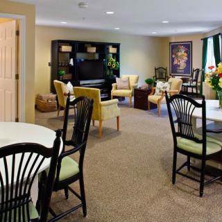 A spacious living room with comfortable seating and elegant decor.