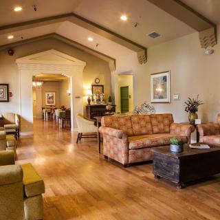 A warm and inviting lobby area featuring comfortable sofas and elegant decor.