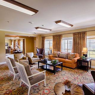 A cozy living room with comfortable seating and elegant decor.