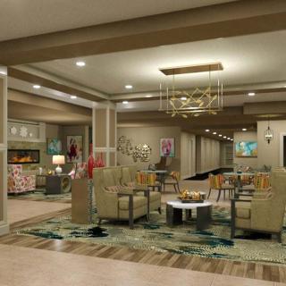 A modern lobby with comfortable seating, decorative lighting, and stylish decor.