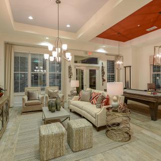 A contemporary living room with elegant lighting and modern furniture.