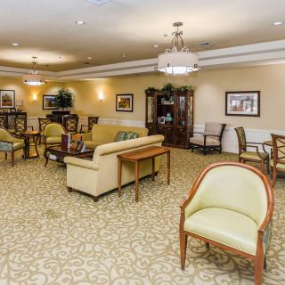 A spacious and elegantly decorated lobby with comfortable seating and warm lighting.