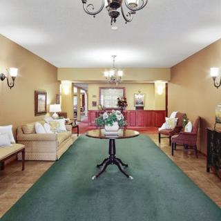 Elegant living room with classic furniture and chandelier.