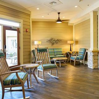 A cozy lounge area with rocking chairs and soft lighting.