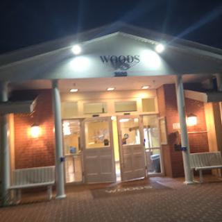 A welcoming restaurant entrance illuminated at night.