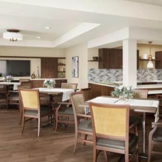 A modern dining room with neatly arranged tables and chairs.