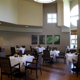A spacious and elegantly designed dining area in a modern restaurant.