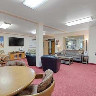 A cozy living room with comfortable seating and a television.