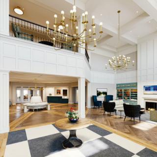 A spacious and elegantly designed lobby featuring high ceilings, chandeliers, and comfortable seating areas.