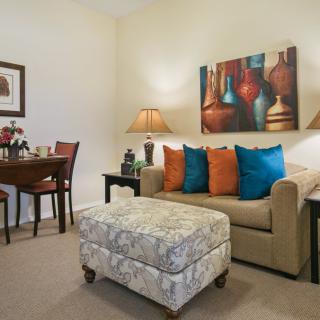 Cozy living room with colorful pillows and elegant decor.