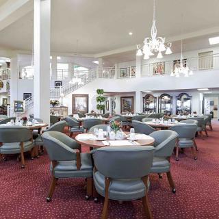 Spacious and elegantly designed restaurant interior with comfortable seating.