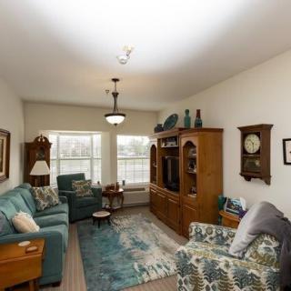 A cozy living room with vintage furniture and decorative accents.
