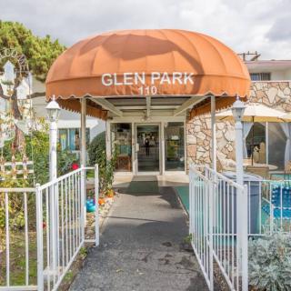 Entrance to a building with an orange awning labeled 'Glen Park'.