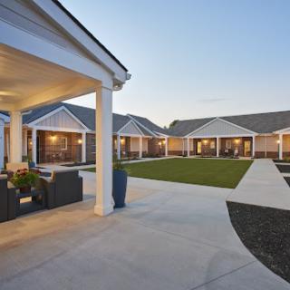 A serene courtyard view of a modern residential complex during twilight.